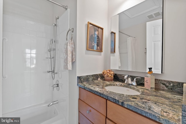 bathroom featuring visible vents, shower / bath combo, and vanity