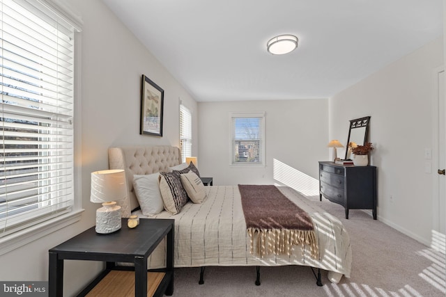 carpeted bedroom with baseboards