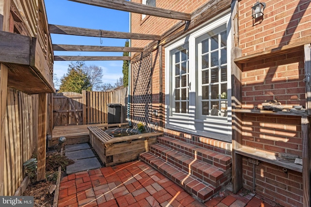 view of patio / terrace featuring fence