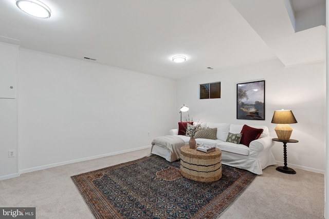 living room featuring baseboards, visible vents, and carpet floors