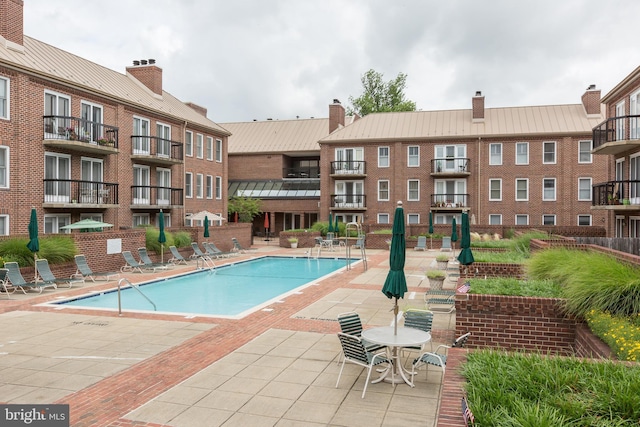 community pool with a patio