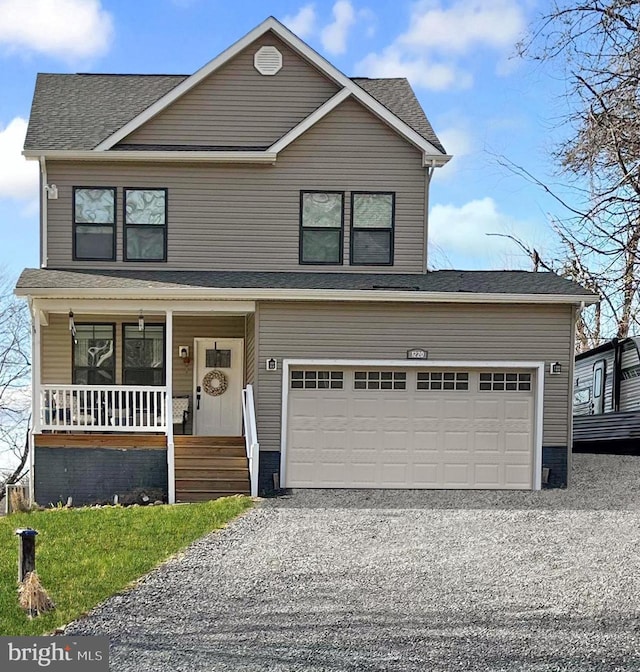 traditional-style home featuring gravel driveway and covered porch