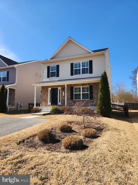 traditional-style house with covered porch