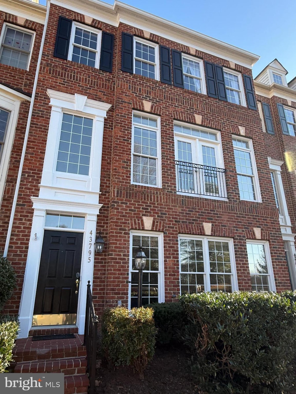 view of property with brick siding