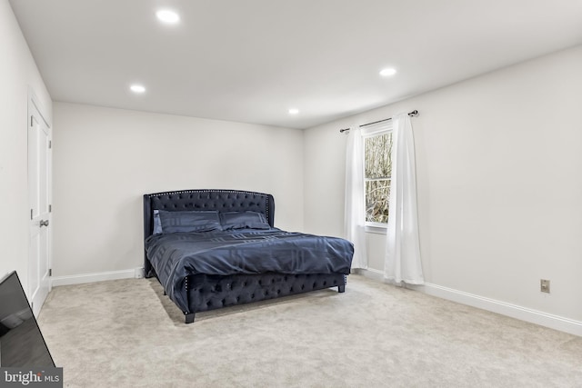 carpeted bedroom with recessed lighting and baseboards