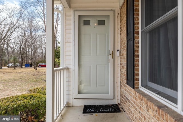 entrance to property with brick siding