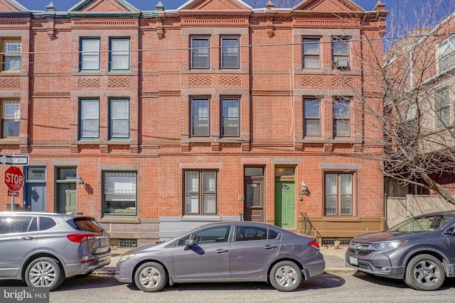 view of property with brick siding