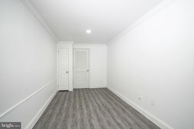 unfurnished room featuring crown molding, recessed lighting, wood finished floors, and baseboards