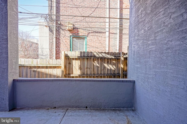 view of patio / terrace featuring fence