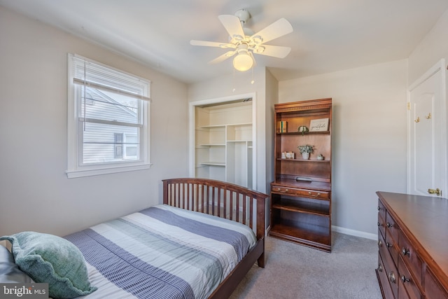 bedroom with baseboards, carpet, and ceiling fan