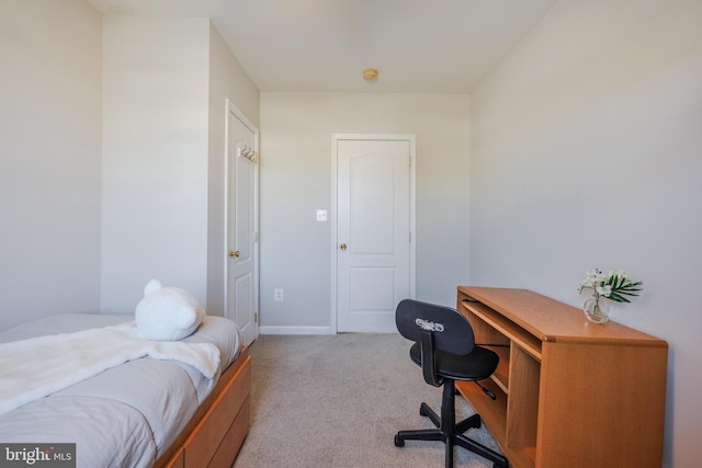 bedroom with baseboards and carpet floors