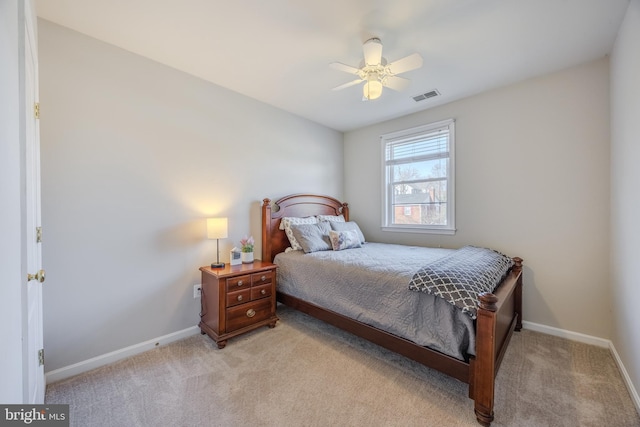 bedroom with light colored carpet, visible vents, and baseboards