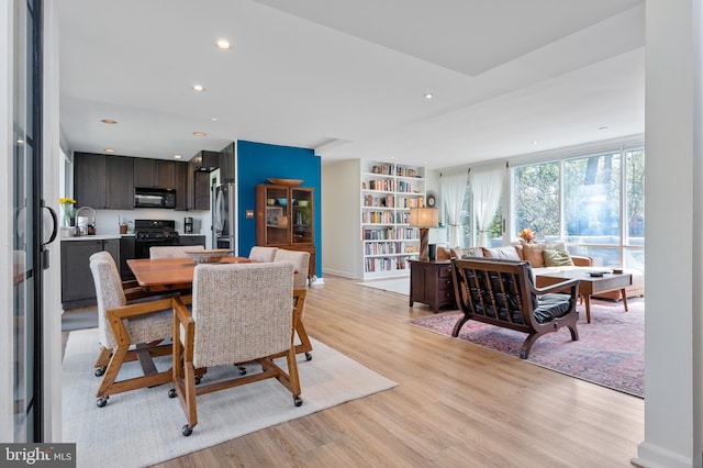 dining area with recessed lighting and light wood-type flooring