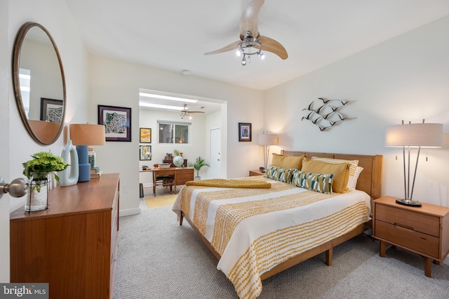 bedroom with light colored carpet and ceiling fan