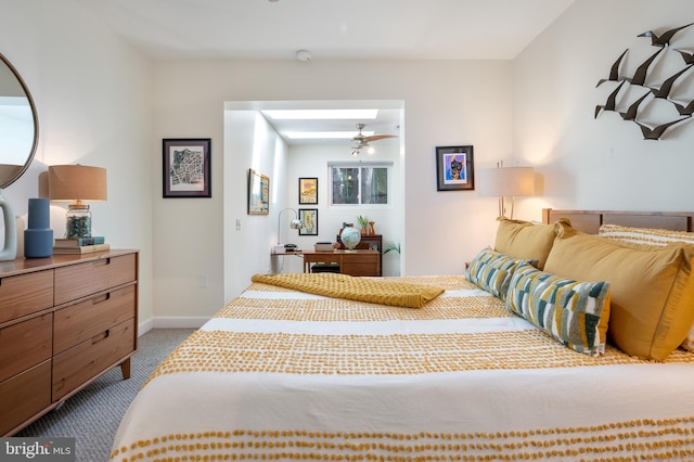 carpeted bedroom featuring baseboards