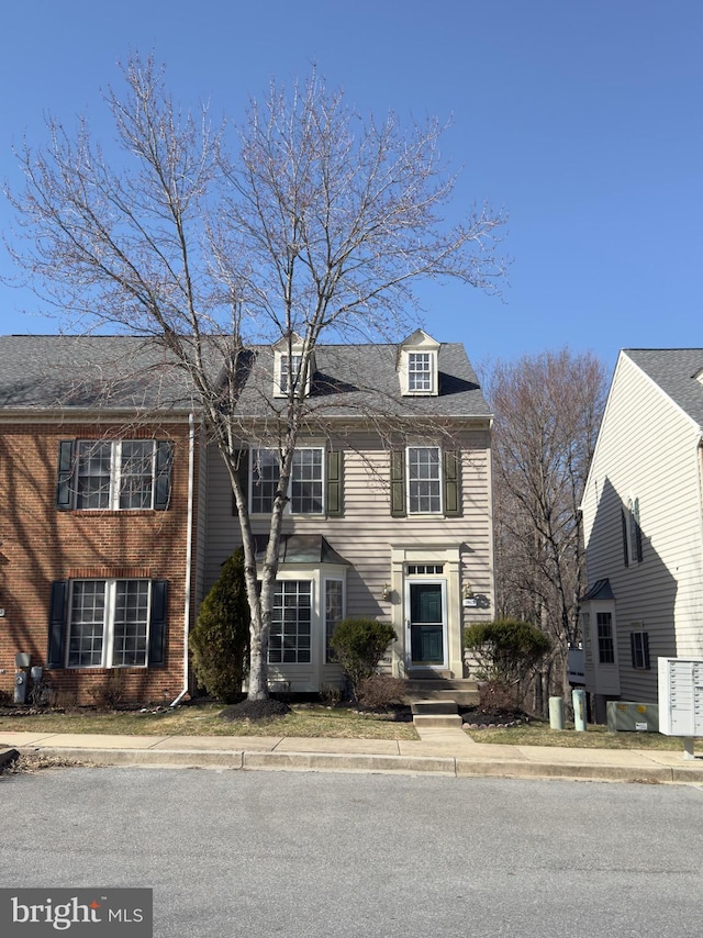 view of front of house featuring brick siding