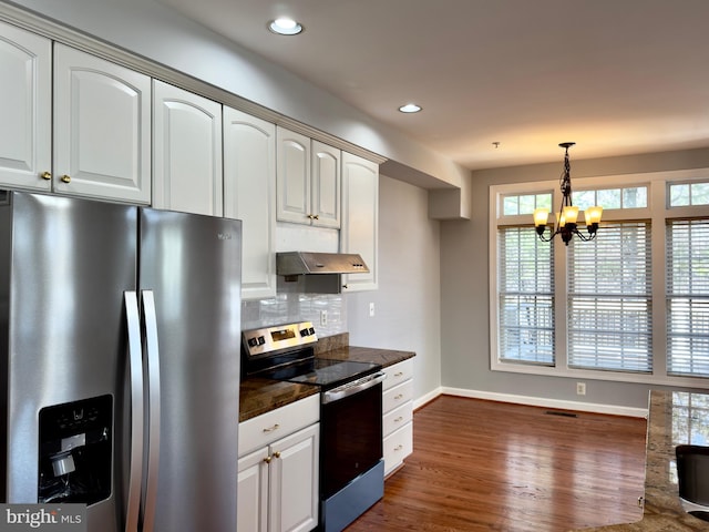 kitchen with recessed lighting, appliances with stainless steel finishes, decorative backsplash, dark wood-style flooring, and hanging light fixtures