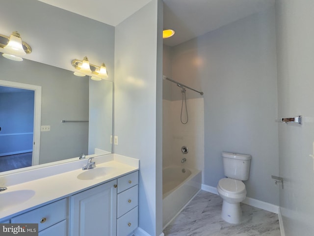 full bath featuring a sink, toilet, marble finish floor, and double vanity