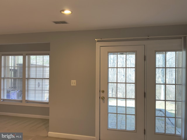 entryway with visible vents and baseboards