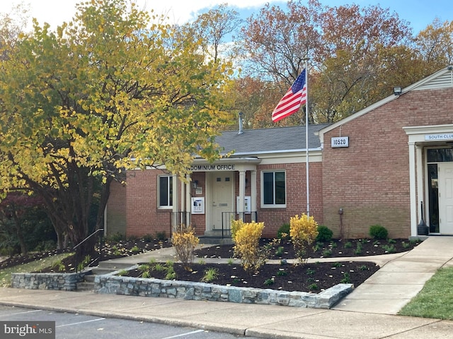 view of front of house with brick siding