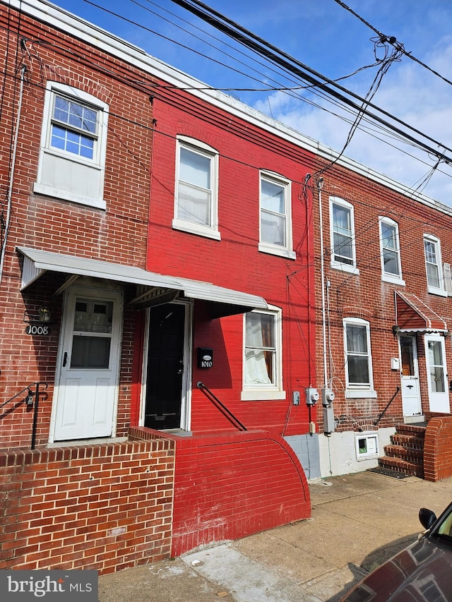 multi unit property featuring brick siding