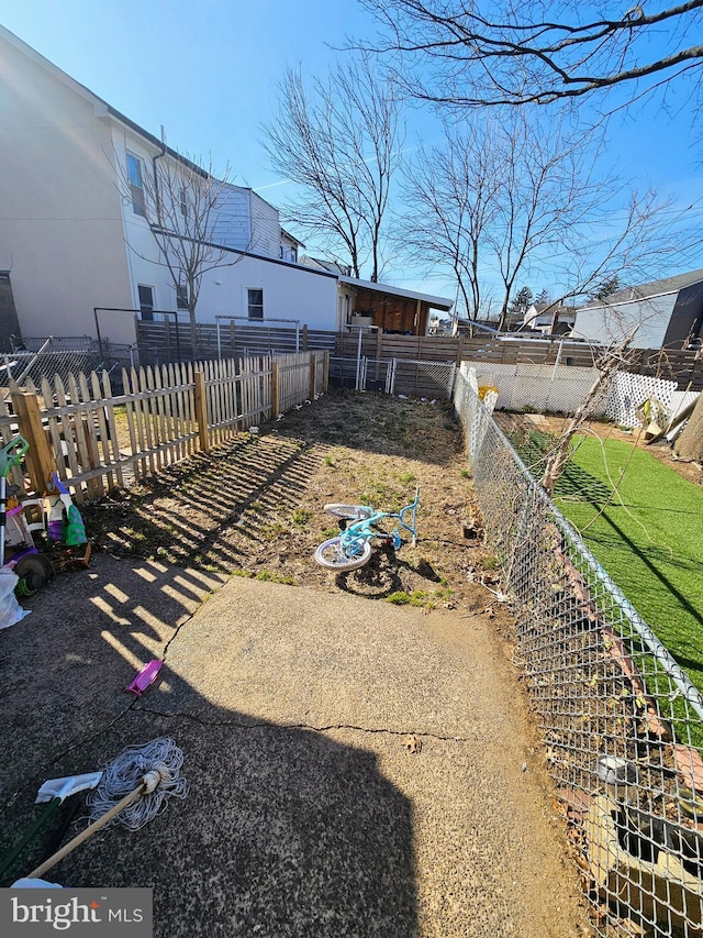 view of yard with an outbuilding and fence private yard