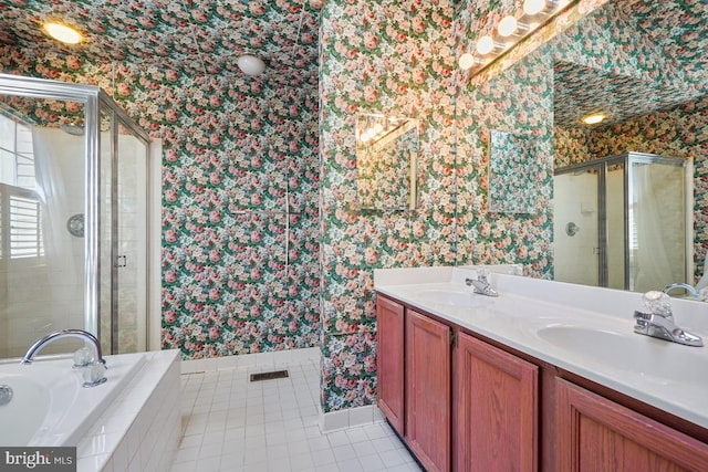 full bathroom with tile patterned flooring, a stall shower, wallpapered walls, and a sink