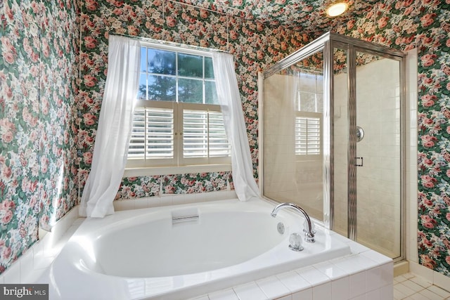 full bathroom with a garden tub, a stall shower, and wallpapered walls