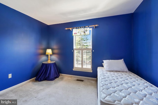 unfurnished bedroom featuring baseboards and carpet floors