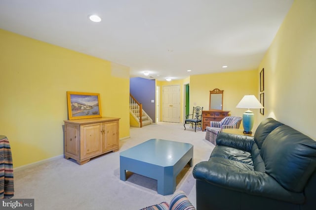 living area featuring recessed lighting, stairway, light carpet, and baseboards