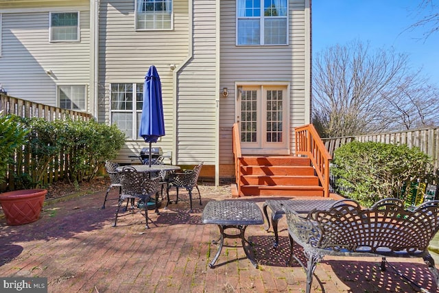 view of patio featuring fence