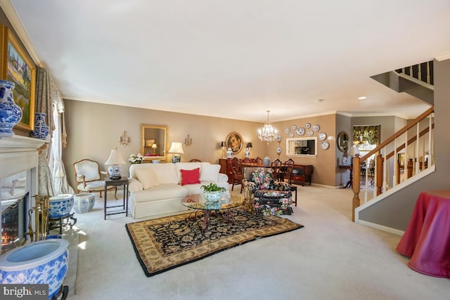 living area with a chandelier, stairs, ornamental molding, carpet floors, and a warm lit fireplace