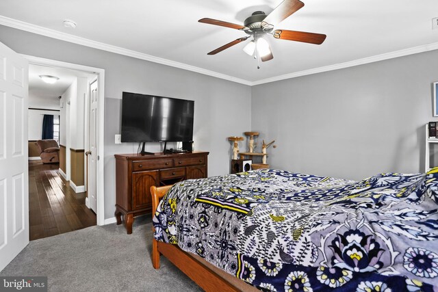 bedroom featuring baseboards, a ceiling fan, carpet, and ornamental molding