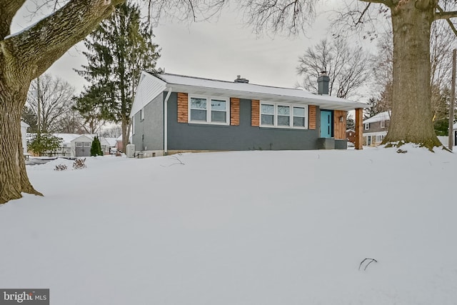 view of front of property with a chimney