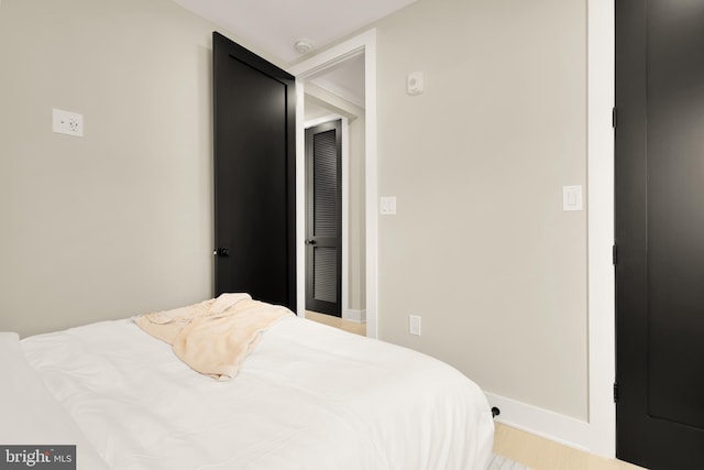 bedroom with wood finished floors