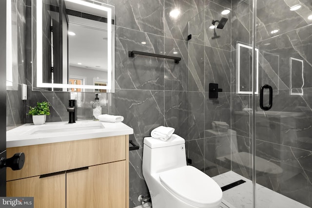 full bath featuring vanity, decorative backsplash, a shower stall, tile walls, and toilet