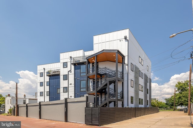 view of building exterior featuring fence