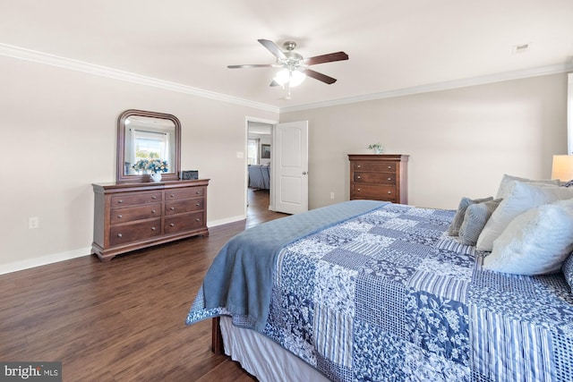 bedroom featuring visible vents, ornamental molding, wood finished floors, baseboards, and ceiling fan