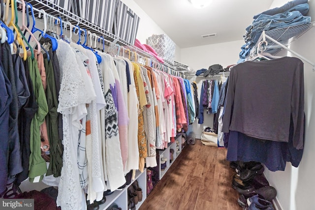 spacious closet with visible vents and wood finished floors