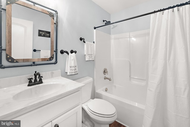 bathroom featuring vanity, toilet, and shower / tub combo