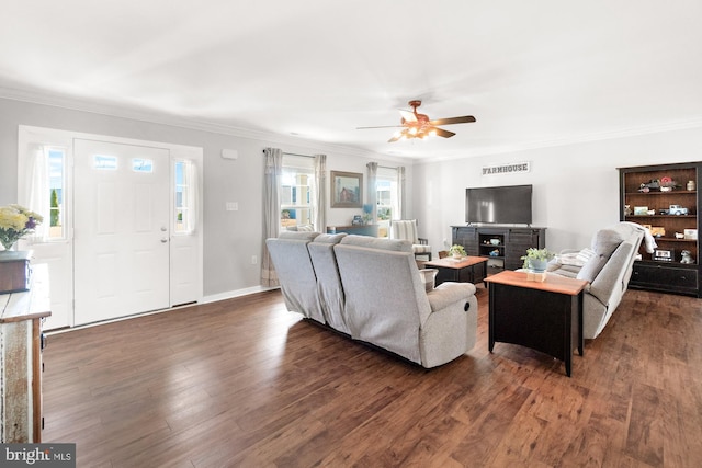 living area with visible vents, baseboards, ornamental molding, wood finished floors, and a ceiling fan