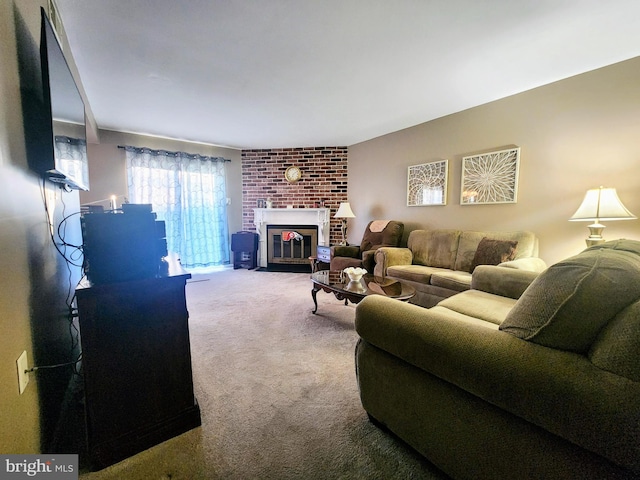 carpeted living area featuring a brick fireplace