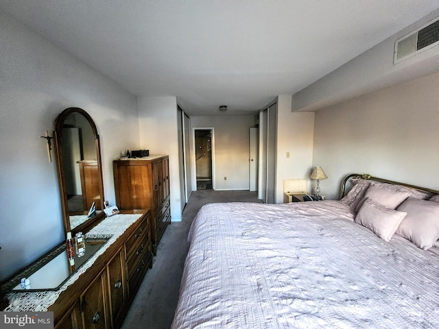 bedroom featuring visible vents and carpet