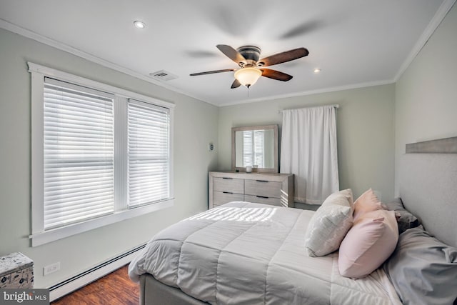 bedroom featuring visible vents, ceiling fan, ornamental molding, wood finished floors, and a baseboard radiator