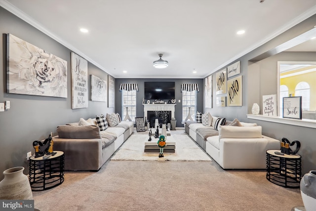 living area featuring carpet flooring, recessed lighting, a fireplace, and crown molding