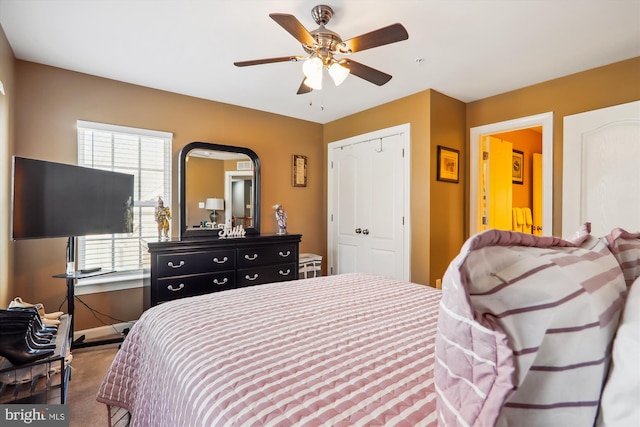 bedroom with a closet, baseboards, and ceiling fan