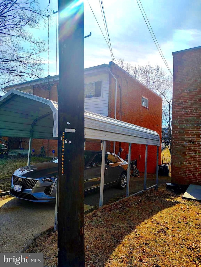 view of parking with a detached carport