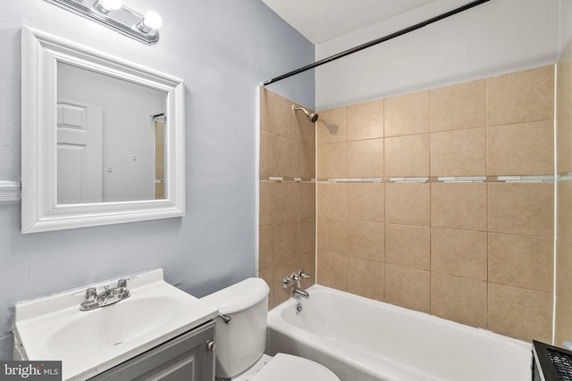 full bath featuring toilet, shower / washtub combination, and vanity