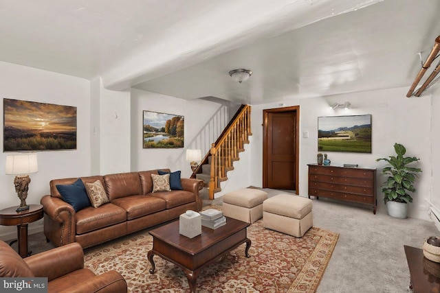 living room featuring stairs and carpet floors