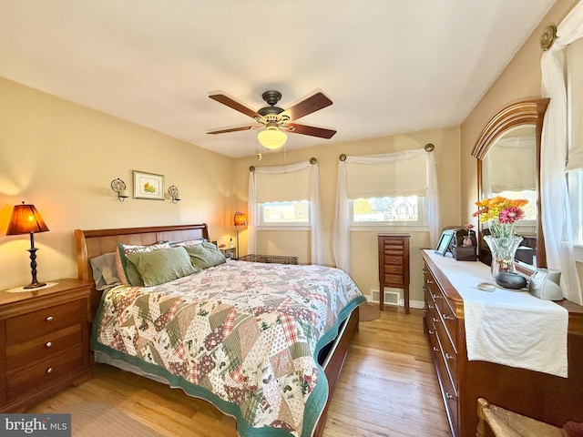 bedroom featuring light wood-style flooring and ceiling fan